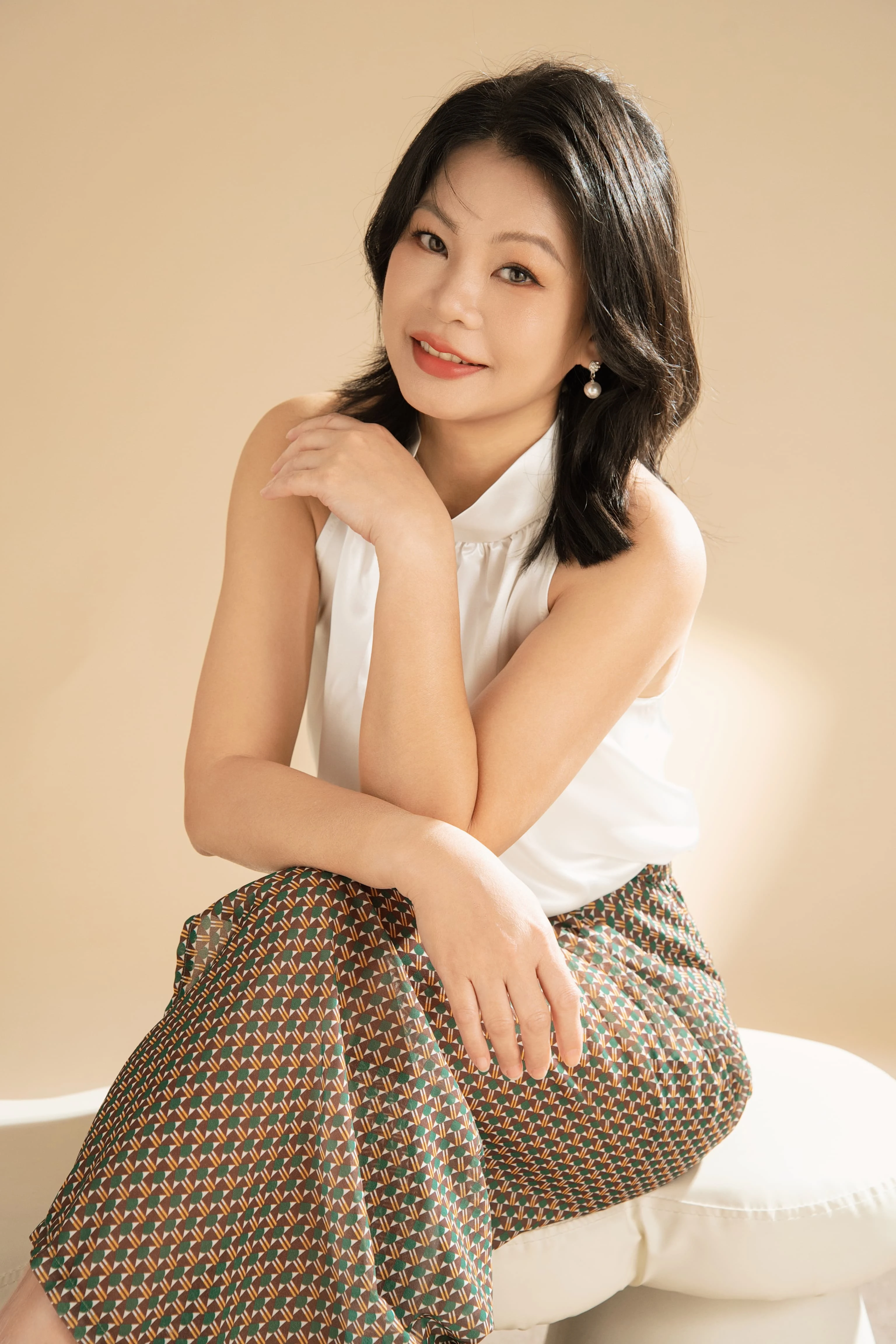 Jewel Beauti founder in a sunlit studio portrait