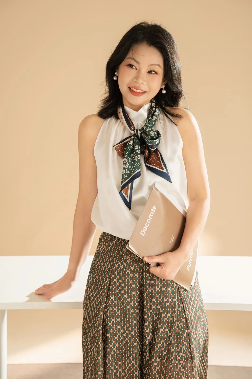 Founder of Jewel Beauti standing in a warm studio